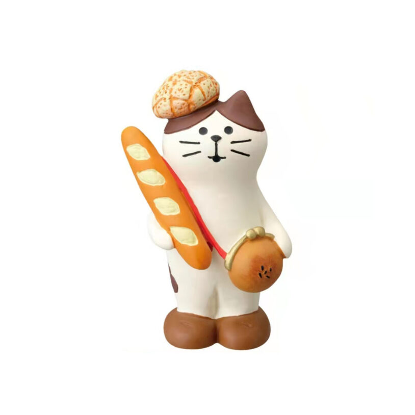 The cat baker holding a long baguette